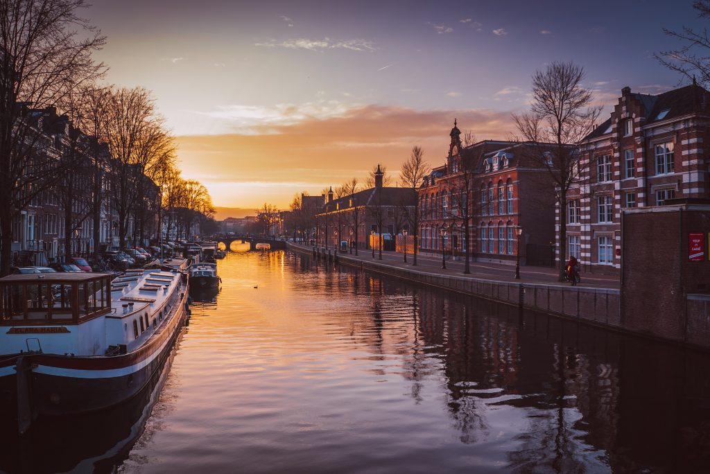 Amsterdam city canal with boat